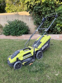 RYOBI 13” corded electric lawn mower with 11-amp motor.