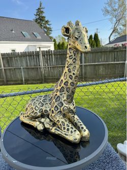 Golden giraffe statue