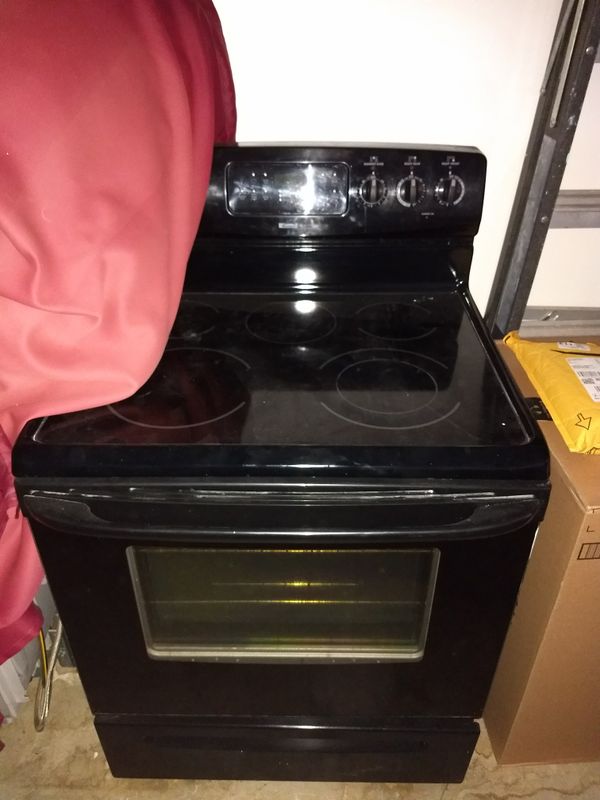 5 burner Kenmore glass top electric stove/ oven, self cleaning (Make an