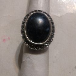 Silver Ring With One Stone In The Center And Onyx Around Size 8 Used