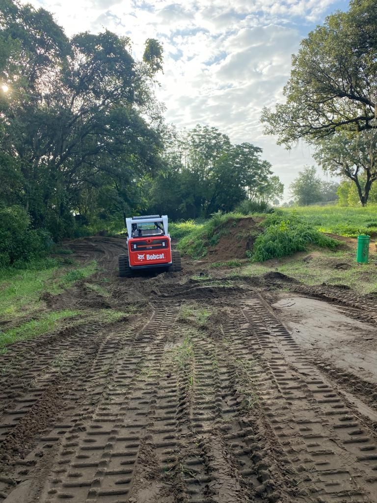 Bobcat and Dump Truck