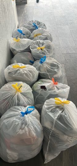 Clothes and shoes. Men, women, children. Varying sizes