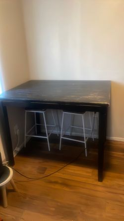 Small black wooden dining table
