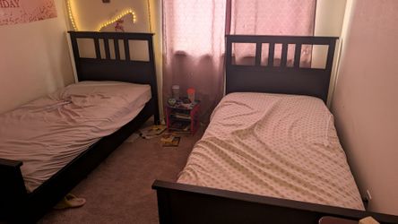 Two twin size bed with a mattress