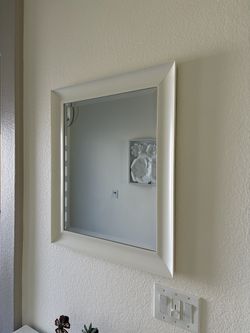 Wall mirror with white frame