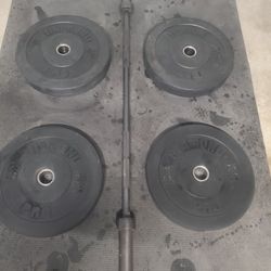 Olympic Weight Set Includes
 5ft Solid 35lb Bar
 2x45lb Bumper Weights 
 2x25lb Bumper Weights
Thats 180lbs All Together With The Bar 