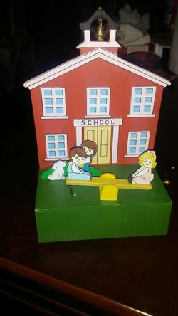 Wooden music box of kids on sea saw