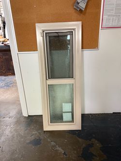 Almond vinyl retrofit window