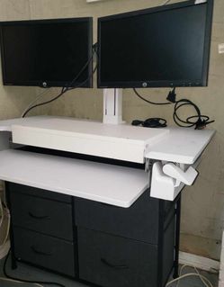 ergonomic height-adjustable workstation and drawers with  two monitors