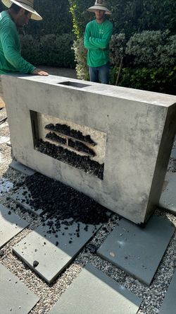 large, custom concrete/GFRC linear gas fire pit