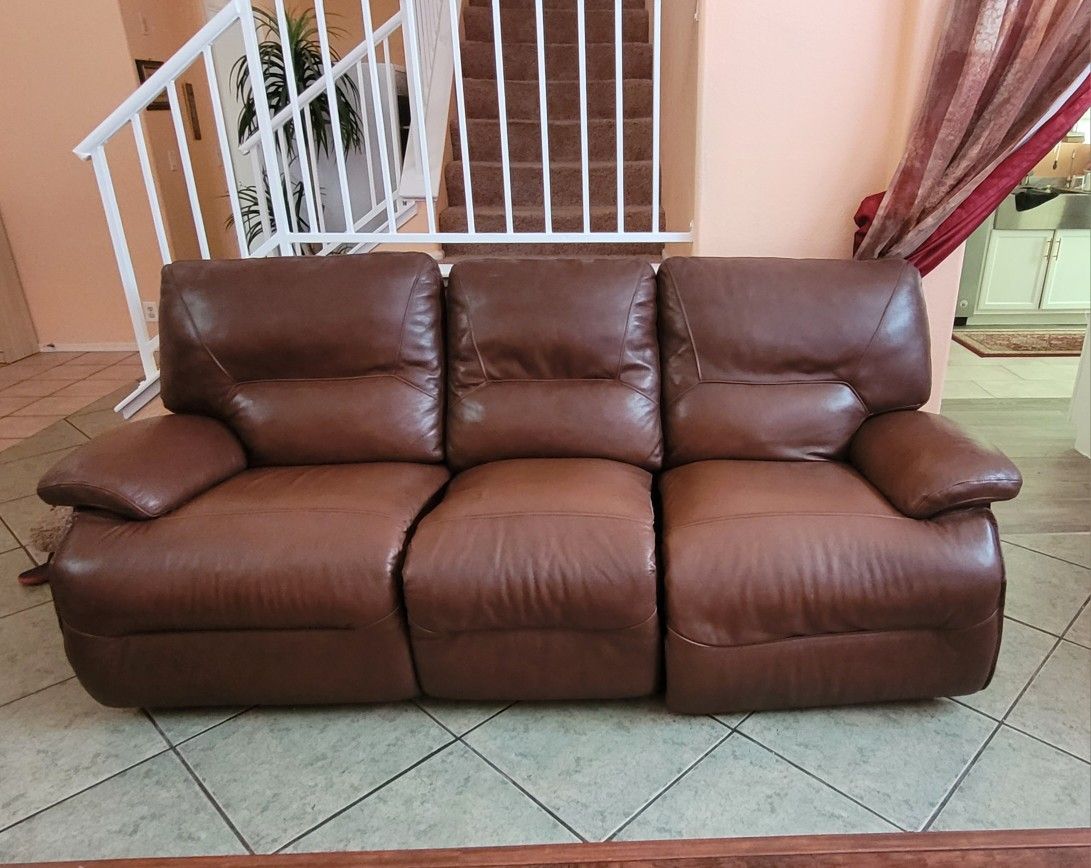 leather sofa with three seats ..recliner . Seats are opens