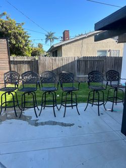 Cast Iron bar height chairs. brand new they go for 300 a peice. they are in great condition
