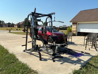 SMITH MACHINE AND 300 Lbs plates ..45 Lbs barrbell