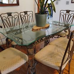 Glass dining room table with six chairs