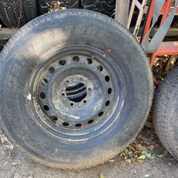 Set of four Bridgestone Dueler H/T tires. Tire size 265/70R 17. Good tread mounted on Toyota. Six lug pattern will also fit Chevy six lug.
