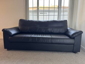 Genuine black leather couch, great condition, hardly used