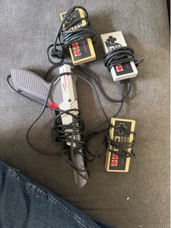 3 Nintendo controller and  gun