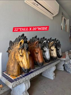 CEMENT HORSE HEADS $100 EACH. AVAILABLE IN DIFFERENT COLORS (22"TALL X 20"WIDE)