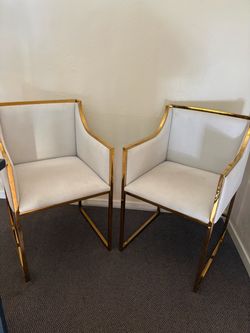 Pair of gold arm chairs