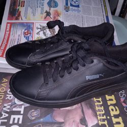 Black Puma sneakers