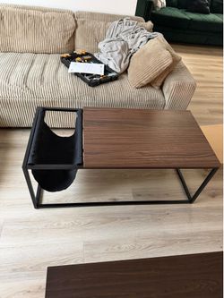 Coffee table with magazine holder