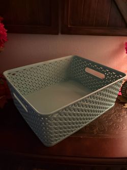 plastic storage bin featuring a textured Y-weave pattern and convenient built-in handles