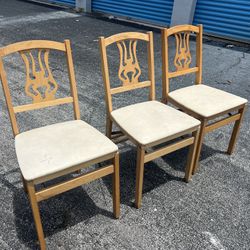 $75 for all 3! 3 Vintage Solid Wooden Folding Chairs! All work great and are sturdy. Two have stains on seat covers. Seat height 17in