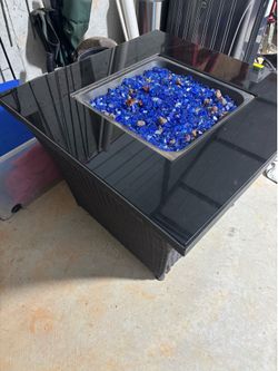 Fire pit table with wicker base