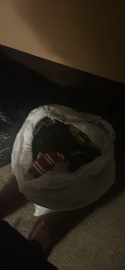 Two trash bags full of clothes