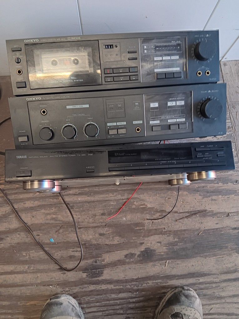 Onkyo amp. Tape Deck. Yamahs Tuner. and RCA 5 CD changer With Remote.