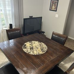 table and tv stand with tv 