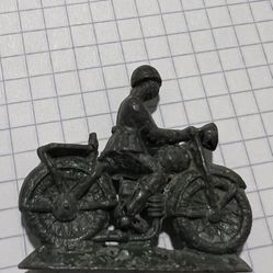 military man on a motorcycle of the USSR 50-70 years old material tin metal