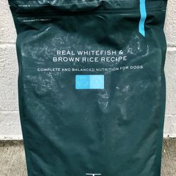 This is a sealed bag of Pawtree Real Whitefish & Brown Rice Recipe flavored dog food. This popular dog food can be served by itself or used as a food 