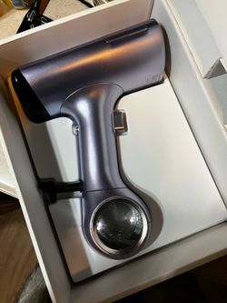 Vacuum garment steamer