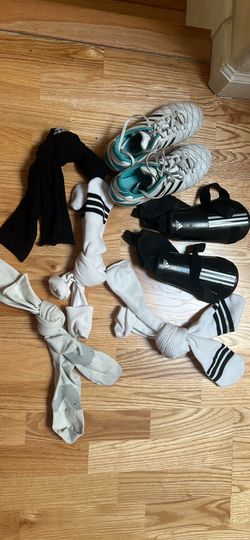 Girl’s soccer cleats, shin guards and socks