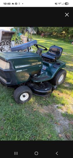 Self propelled mower bagger
