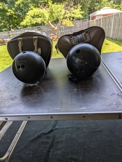 Two Bowling Balls With Cases