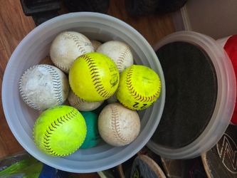 Bucket of softballs and foam balls