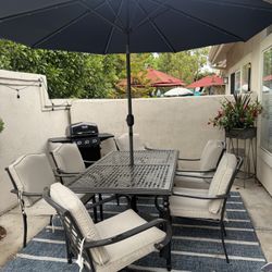 Patio Table, Chairs And Umbrella