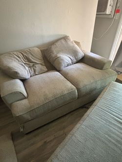 Loveseat with leg rest