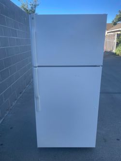 GE top and bottom refrigerator for $170. Dimensions are 28Wx28Dx62H. Pick up only.