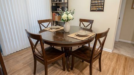 54” Round Glass Dining Table Set with 4 Dark Wood Cross-Back Chairs