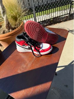 Those are Nike Air Jordan 1 Mid "Chicago" colorway