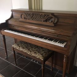 Kimball upright piano with stool.