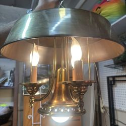 vintage brass bouillotte-style chandelier is priced at $89.94 Located in booth 117 on Arizona aisle at the brass armadillo on 28th dr and Cactus 