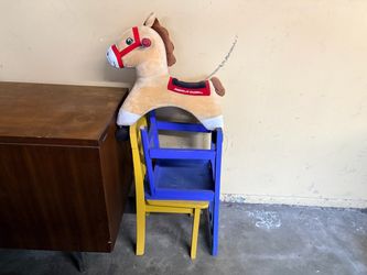 2 kids chairs and children’s rolling horse