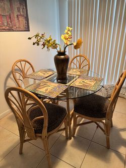 42” diameter glass top dinette with rattan chairs