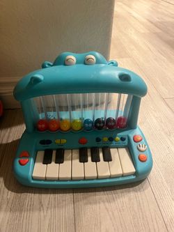 B. Toys Hippo Pop Piano