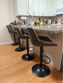 Set of 4 brown barstools adjustable height