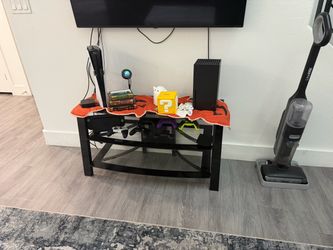 Black glass TV entertainment stand and Halloween decor